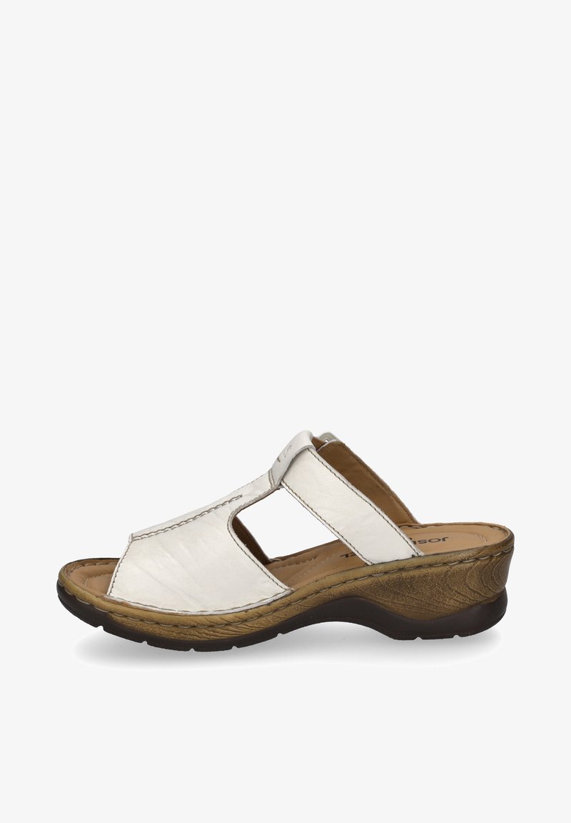 White leather slide sandal with two cut-out openings, textured brown wedge heel, and padded insole for comfort.