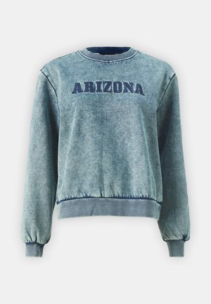 Světle modrá mikina s výšivkou "ARIZONA" v tmavě modré barvě. Má žebrované manžety a lem, měkkou texturu a kulatý výstřih.