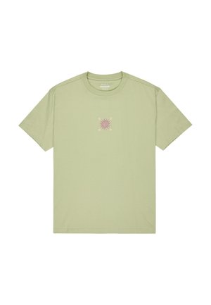 T-shirt in cotone verde chiaro con maniche corte e colletto a giro. Presenta una grafica di sole rosa sull'area del petto. Tessuto morbido.