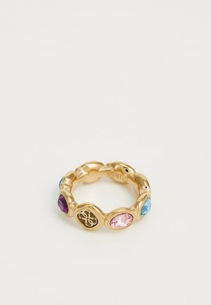 Gold-tone ring featuring oval multicolored stones: purple, pink, and blue. Intricate pattern on one section. Smooth, rounded edges.