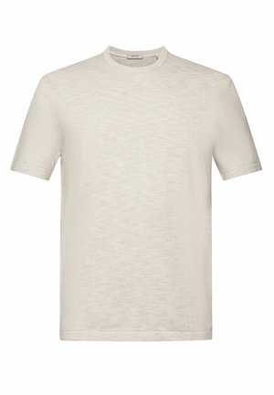 Jasnobeżowa koszula z krótkim rękawem z miękkiego, fakturowanego materiału, z okrągłym dekoltem i subtelnym prążkowaniem przy kołnierzu, dopasowana do ciała.