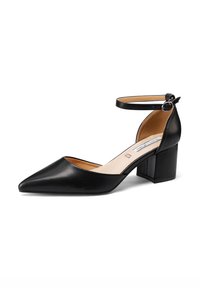 Décolleté nera in pelle con punta affusolata, cinturino alla caviglia e fibbia. Presenta un tacco a blocco e una soletta beige. Texture liscia e design minimalista.