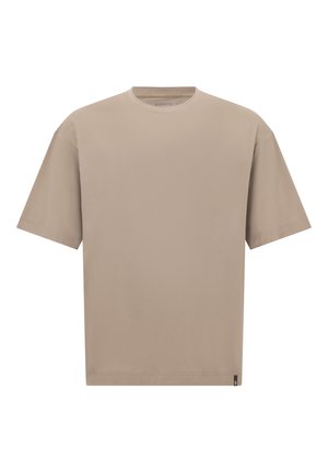 Beige ylipitkä t-paita, joka on valmistettu pehmeästä puuvillasta. Paita on pyöreäkauluksinen, lyhythihainen ja siinä on suora helma, sekä minimaalinen brändäys sivussa.