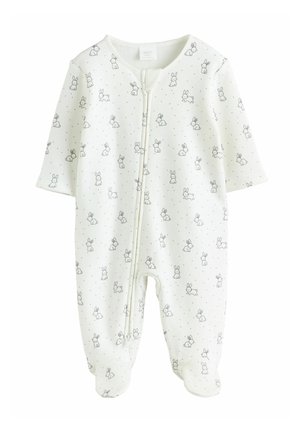 Bodysuit blanc pour nourrisson en tissu doux avec des manches courtes, décoré d'un motif de lapin et de petits motifs en pois, avec une fermeture éclair à l'avant.