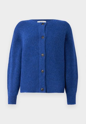 Blå strikket cardigan med rund hals, lange ermer og seks svarte knapper foran. Strukturert stoff med en myk overflate.