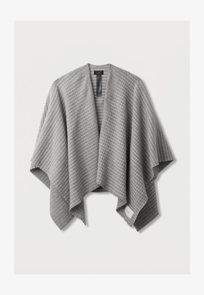 Hallide hallide kootud kattega, tekstuurse mustriga, avatud esiosaga ja pehme viimistlusega. Omab sildi alumisel äärel.