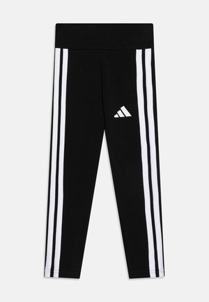 Colanți negri dintr-un material moale, cu trei dungi verticale albe pe fiecare parte și un logo alb Adidas pe față.