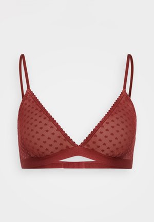 Brassière rouge avec un design en maille à pois transparent, une bande solide, des bretelles réglables et une bordure décorative en picot.
