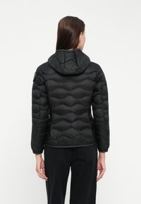 Black puffer jacket with a hood, featuring a quilted design, textured fabric, elastic cuffs, and a zipped front.