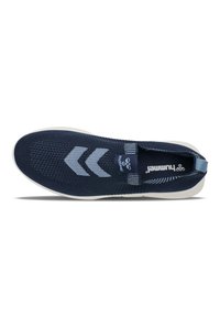 Navy blue athletic shoe with a knitted upper, white sole, and three light blue chevron stripes on the side. Features elastic slip-on design.