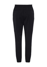 Black trousers with a tapered design, elastic waistband, and two back pockets. Smooth texture, no visible patterns or hardware.