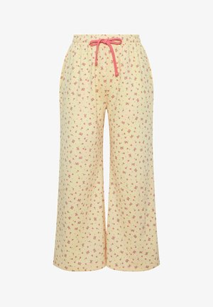 Lysegule bukser med brede ben, små pink blomsterprint og pink snøre i taljen, med sidelommer.