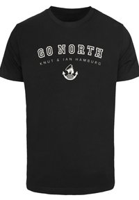 Black cotton t-shirt featuring white text that reads "GO NORTH" along with graphics including an anchor and a figure in a hat.