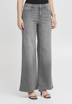 Jeans grigi con gamba ampia e vita alta, con il classico stile a cinque tasche e leggera scoloritura. Realizzati in denim con una trama liscia.