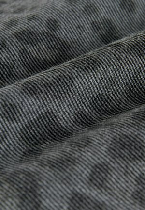 Gray woven fabric with a textured surface, featuring a subtle striped pattern. The material appears soft and flexible, suitable for clothing.