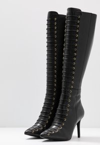 KIOMI Botas con cordones - black