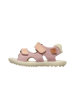 Children's pink suede sandal with beige sole, two adjustable straps, and a cushioned heel patch.