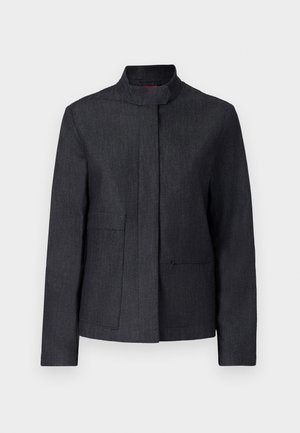 Dark gray jacket with a stand-up collar, two front pockets, and a clean design. Made from textured fabric, offering a minimalist look.