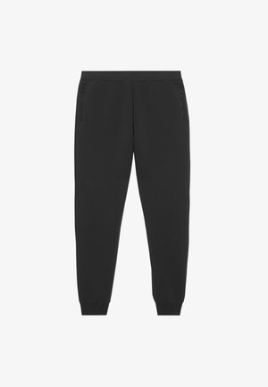 Pantalons de survêtement noirs en matériau doux avec deux poches latérales zippées, design de jambe fuselée et taille élastique pour le confort.