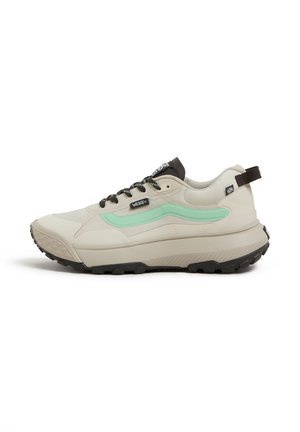 Baskets Vans beige avec semelles noires, lacets noirs et bande latérale vert menthe, vues de profil gauche.