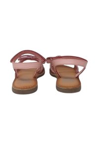 Infradito rosa con due cinturini, parte superiore in pelle liscia e soletta testurizzata; apertura sul retro per una facile calzata.