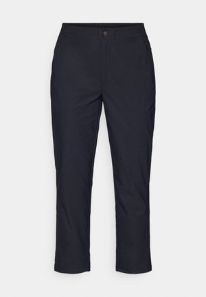 Pantalons bleu nuit foncé avec une texture lisse, dotés d'une taille élastique et d'une fermeture à bouton métallique. Coupe droite avec des chevilles ourlées.