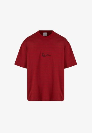 Czerwona bawełniana koszulka z luźnym krojem, okrągłym dekoltem i krótkimi rękawami. Zawiera czarną haftowaną grafikę na piersi oraz teksturowany wzór.