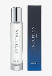 Intuition eau de parfum i en klar glasflaske med sølv låg; navy kassen har hvid tekst. 10 ml størrelse, slankt og moderne design.