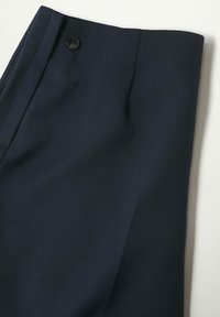 Navy blue tailored trousers featuring a smooth texture, front pleat, and a single black button at the waistband. Simple design, no patterns.