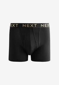 Fekete boxer alsónemű, puha pamutkeverékből készült. Rugalmas derékkal rendelkezik, amelyen aranybetűkkel a "NEXT" felirat található. Klasszikus dizájn, testhezálló fazon.