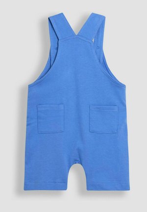 Sininen puuvillainen haalari, jossa on olkaimet, kahdella etutaskulla, lyhyet lahkeet ja sileä, pehmeä rakenne.