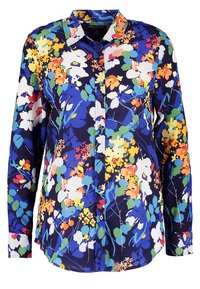Långärmad skjorta med knappar som har en marinblå bakgrund med färgglada blommönster i gult, vitt, blått och grönt. Slinky tygtextur.