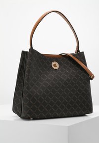 Brown leather tote bag with a diamond pattern, featuring a gold circular clasp and a single brown handle for easy carrying.
