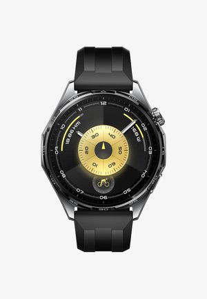 Black sports watch with a metallic bezel, gold accents, a circular face, textured dial, and a silicone strap; features multiple dials and markings.