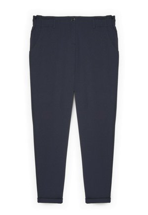 Pantalon bleu marine en tissu extensible, présentant une texture lisse, des poches avant et des revers aux chevilles.