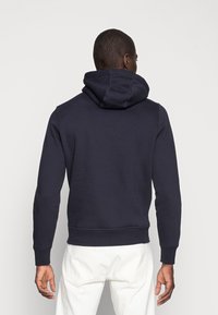 Alle Tommy hilfiger logo hoodie im Blick