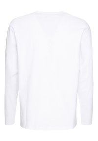 Langærmet, hvid bomulds t-shirt med V-udskæring og lige pasform. Har minimal syning og ingen synlige logoer eller mønstre.