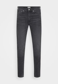 Jeans de denim negro ajustados con una textura suave, diseño de cinco bolsillos y herrajes metálicos en la parte delantera. Estilo clásico y versátil.