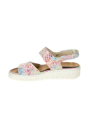 White platform sandal with colorful, textured straps and a cork insole, featuring an open toe and adjustable back strap.
