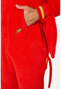 Red fleece jumpsuit featuring a pocket with a lime slice embroidery, wrist cuffs in yellow and red stripes, and a tie detail on the side.