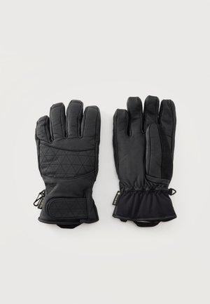 Paire de gants isolants noirs avec paume matelassée, sangles de poignet réglables et étiquettes Gore-Tex, posée à plat sur un fond clair.