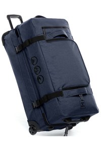Marineblaue Rollreisetasche aus strukturiertem Material, mit schwarzen Trägern, multifunktionalen Griffen und drei schwarzen Symbolen an der Seite.