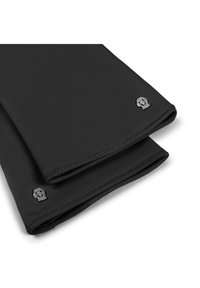 Black leather gloves with stitched edges and a small silver skull emblem on the wrist. Smooth texture, fitted design.