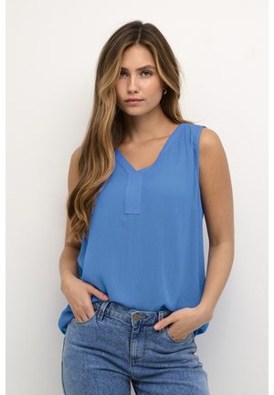 Light blue sleeveless top with a V-neckline and a subtle textured fabric, paired with light denim jeans. Simple and casual design.