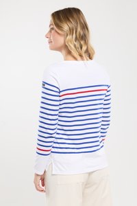 Witte lange mouwen shirt met blauwe en rode horizontale strepen. Heeft een bottem neckline en zijsplitten. Etiket zichtbaar op de linkermouw.