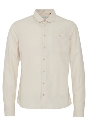 Light beige long-sleeve shirt with a button-down collar, single chest pocket, and subtle texture. Features front button closure.