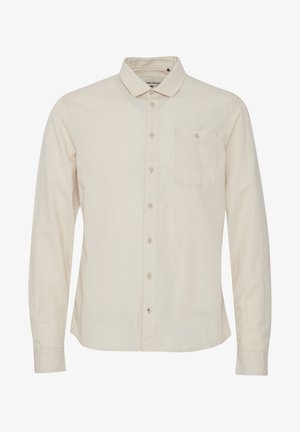 Kreemikas pikkade varrukatega särk nööpidega kraega, ühe rinna taskuga ja õrna tekstuuriga. Omab ees nööpidega kinnitust.