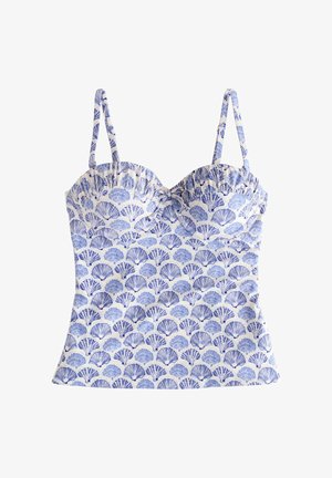 Wit mouwloos topje met blauw schelpenpatroon en dunne schouderbandjes, aansluitende buste en licht uitlopende zoom.