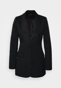 Blazer nero realizzato in tessuto testurizzato, con risvolto in satin, due tasche frontali e chiusura con singolo bottone. L'interno è foderato in materiale scuro.