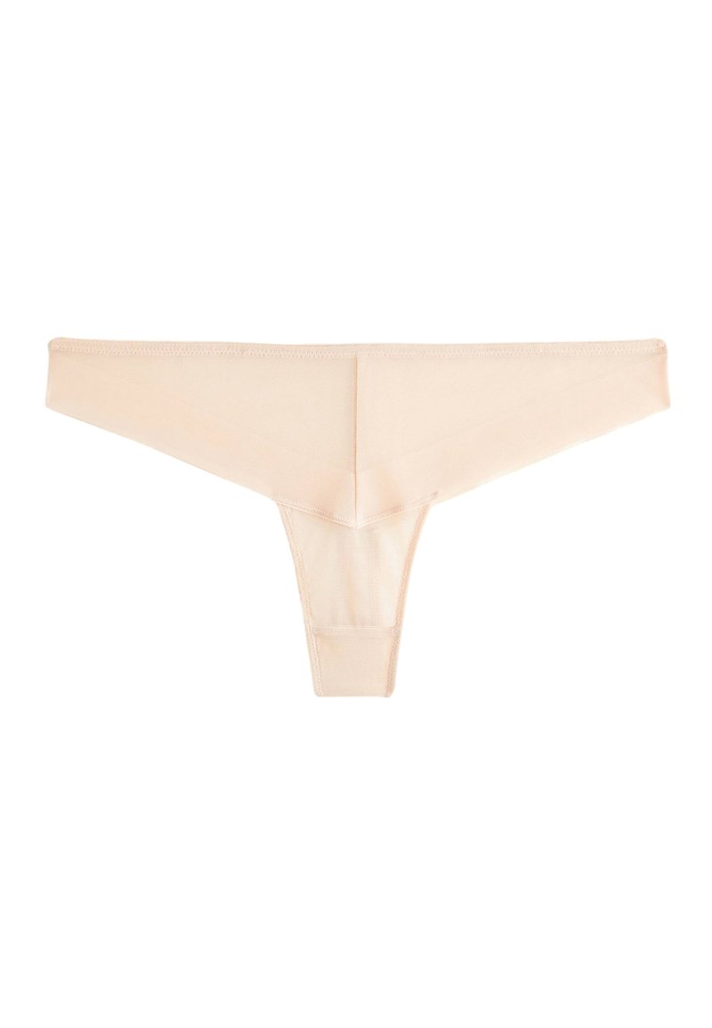 String beige en tissu lisse, doté d'un design minimaliste, de côtés étroits et d'une finition sans coutures pour un confort optimal et un port discret.
